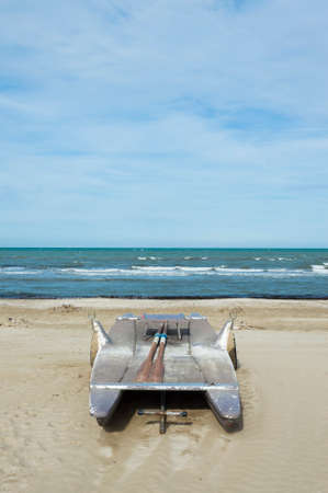 Old boat beached at the river of the seaの写真素材