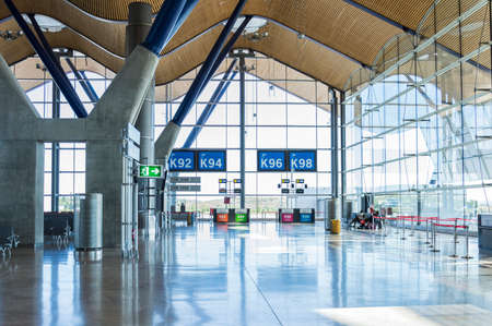 Madrid, Spain: 16th July 2016: The Madrid-Barajas Airport is Spain's largest and busiest airport, characterised by a floating roof propped by an internal coloured structure.のeditorial素材