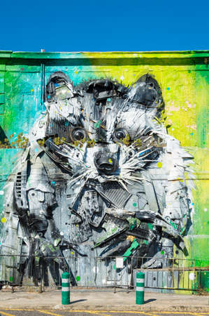 Lisbon, Portugal - 17th July 2016: Raccoon, Lisbon city street art. The famous Portuguese artist Bordalo II making his works with recycled materials that he found on streetsのeditorial素材
