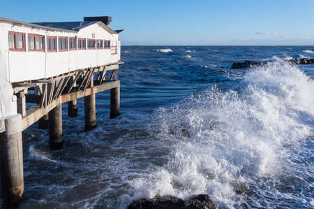 Rough sea with white house in Adriatic sea, Italyの写真素材