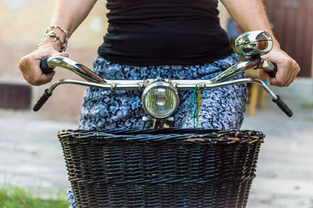 Close up details woman riding vintage bikeの写真素材