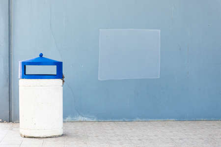 Outdoor dust bin isolated over urban backgroundの写真素材