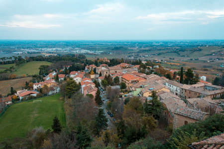 Small italian town Bertinoro, surrounded by vineyards, meadows, areas of production of traditional italian red wine Sangioveseの写真素材