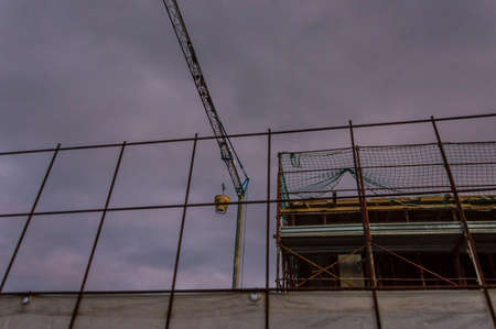 Work site: urban project, building for people in construction, evening hours