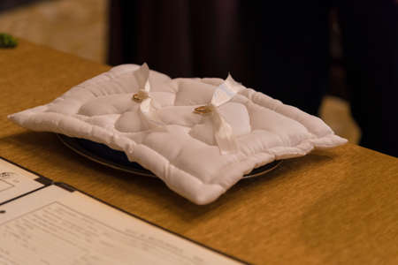 Beauty wedding rings on the lace pillowの写真素材