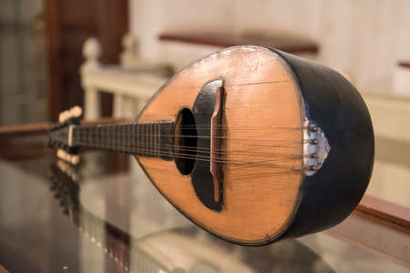 Focus on an ancient folk musical instrument, mandolin