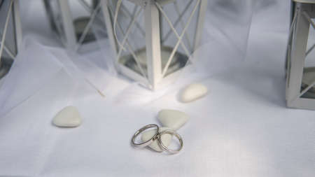Close up of Wedding rings near comfits and wedding favorsの写真素材