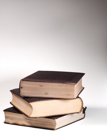 Stack of old books on white background. Back to school concept.の写真素材
