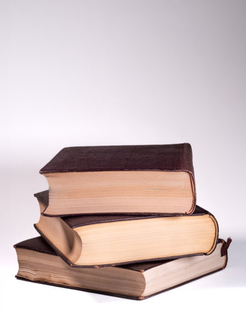 stack of old books on a white background, close-up.の写真素材
