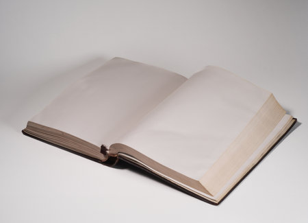 Open book with blank pages isolated on white background. Vertical photo.の写真素材