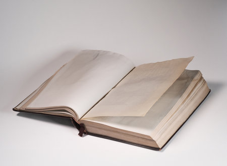 Open book with blank pages on a white background.の写真素材