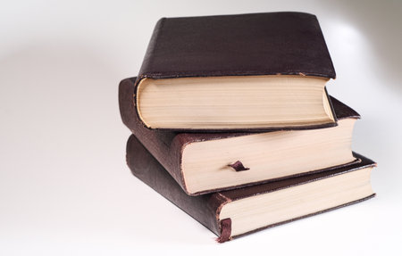 stack of old books on a white background with copy space for textの写真素材
