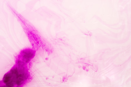 abstract watercolor background with pink and purple paint splash on whiteの写真素材