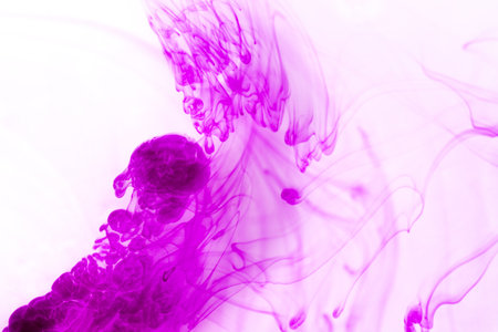 abstract background with purple ink splash in water, close-upの写真素材