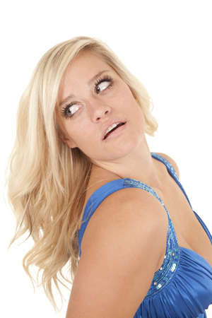 A woman with  her head tilted back in her blue dress.の写真素材