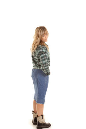 A woman standing and looking over her shoulder with some attitudeの写真素材