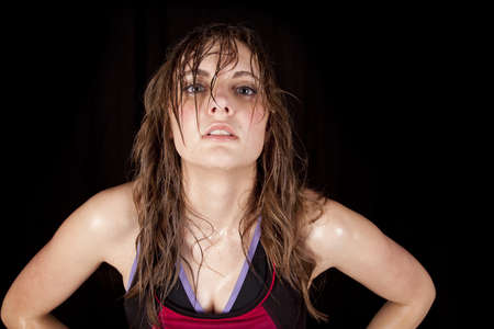 a woman after a workout with sweat running down her neck and face.の写真素材