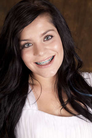 A close up of a teen girl with a happy expression on her face.の写真素材