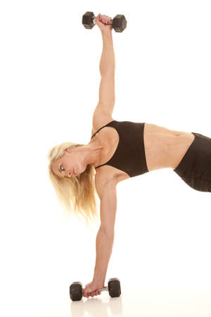 A woman lifting up her body using weightsの写真素材