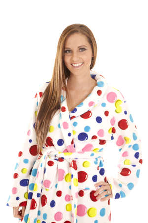 A woman in her colorful bathrobe smiling and posing.の写真素材
