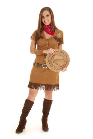 A woman in her cowgirl costume with a big smile on her lips.の写真素材