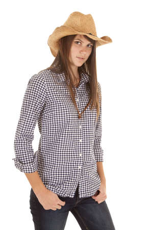 A woman in her cowgirl hat with a serious expression on her face.の写真素材