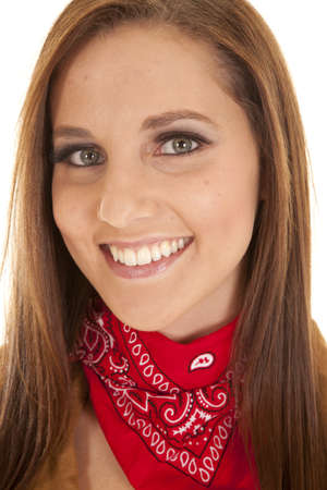 a close up of a woman with a smile on her face wearing a red bandana.の写真素材