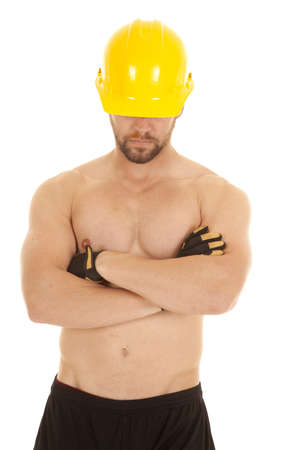 A construction worker with his hard hat on and gloves without a shirt on.の写真素材