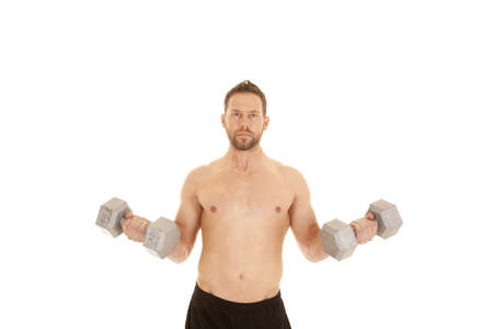 A man working out with weights, working out his arms without a shirt on.の写真素材