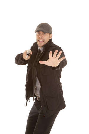 A man pointing his pistol yelling.の写真素材