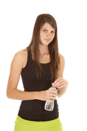 a woman holding on to her water bottle getting ready to have a drink.の写真素材