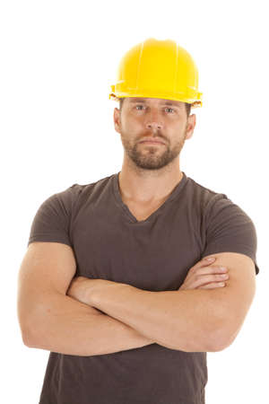 A construction worker with his arms folded and a serious expression on his face.の写真素材