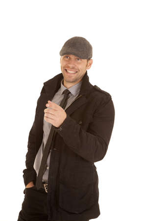 A man with a smile on his face pointing his finger at something.の写真素材