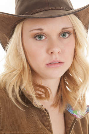A close up of a woman's face with a sad expression in her eyes.の写真素材