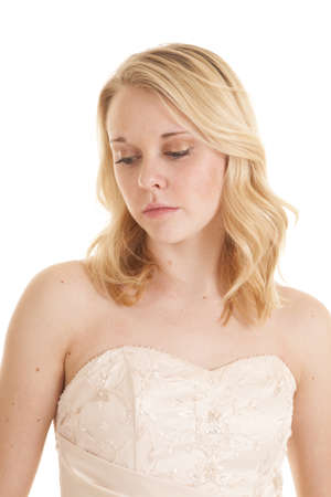 A woman with a sad look on her face in her formal dress.の写真素材