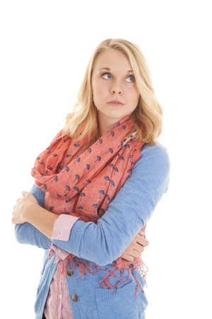 A woman with a serious expression on her face, with her arms folded.の写真素材
