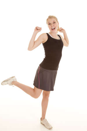 a woman with a big smile on her face happy to have her workout over with .の写真素材