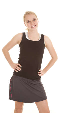 A woman with a big smile on her face in her workout clothesの写真素材