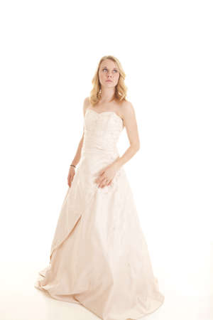 A woman with a faraway look in her eyes in her formal dress.の写真素材