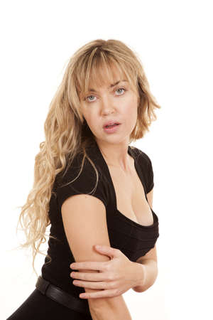 a woman in her black dess with a sensual expession on her face.の写真素材