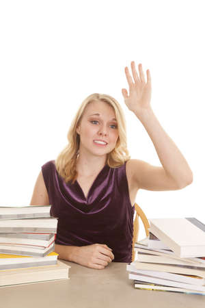 A woman with her hand raised needing some help.の写真素材
