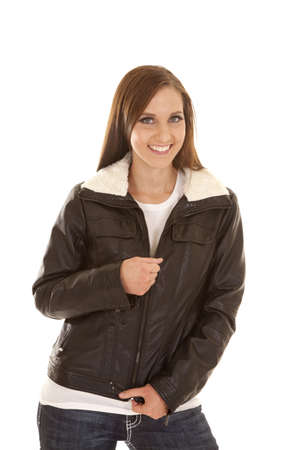 A woman with a smile on her face in her warm jacket.の写真素材