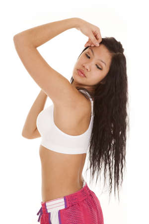 A woman showing off her body in her fitness clothesの写真素材