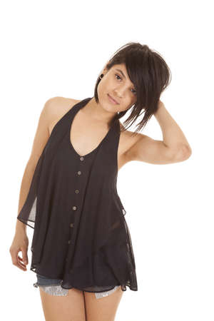 A woman showing off her sensual side in her tank and short shorts.の写真素材