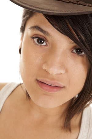 A close up of a woman looking at the camera with a serious expressionの写真素材