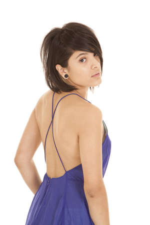 a woman looking over her shoulder in her purple dress.の写真素材