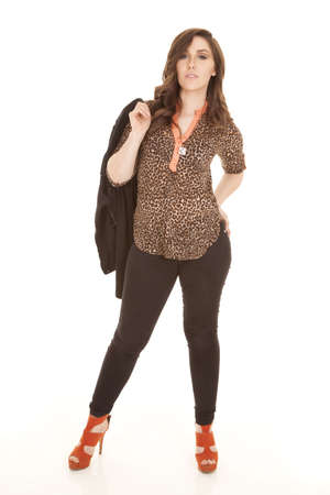 A woman showing off her fashion with a serious expression on her face,の写真素材