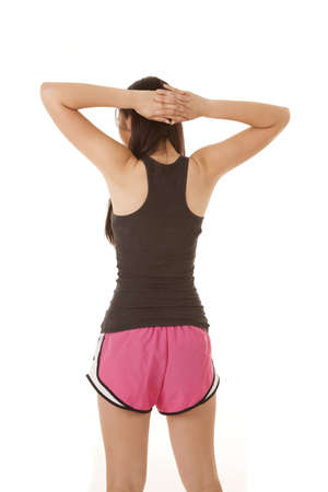 A woman stretching out her shoulders after working out.の写真素材