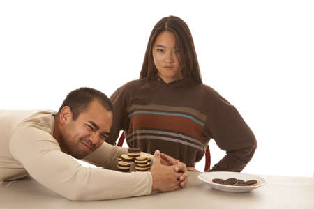 A woman not happy that someone is stealing her cookiesの写真素材