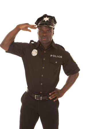 Police officer soluting with a serious expression.